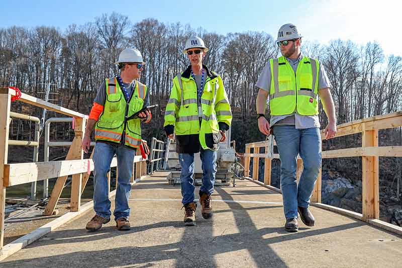 Matt Huebner, Jeff Munsey and Harrison Strickland on Nolichucky Dam.