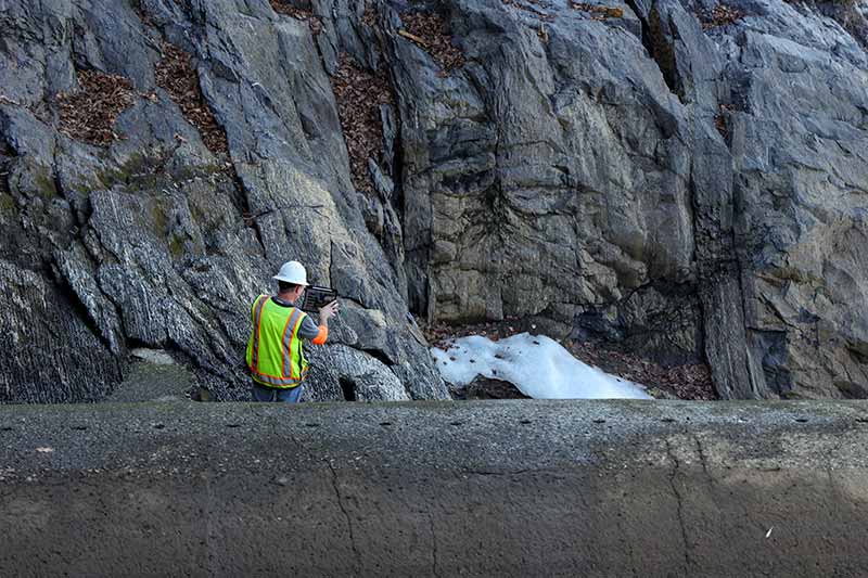 Matt Huebner assesses cliffs for dam safety at Nolichucky.