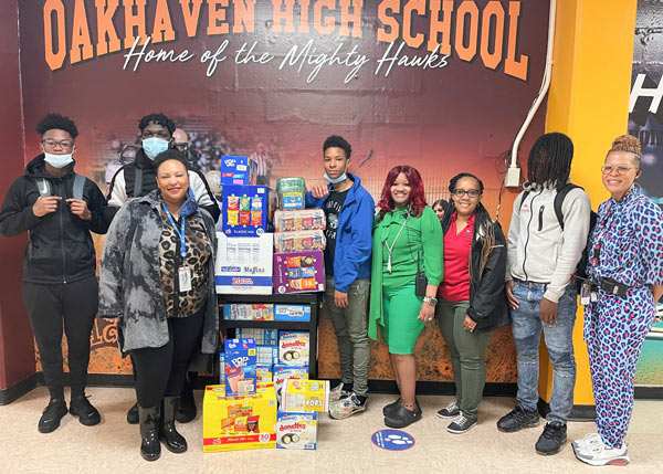 Teachers and kids with donation Boxes