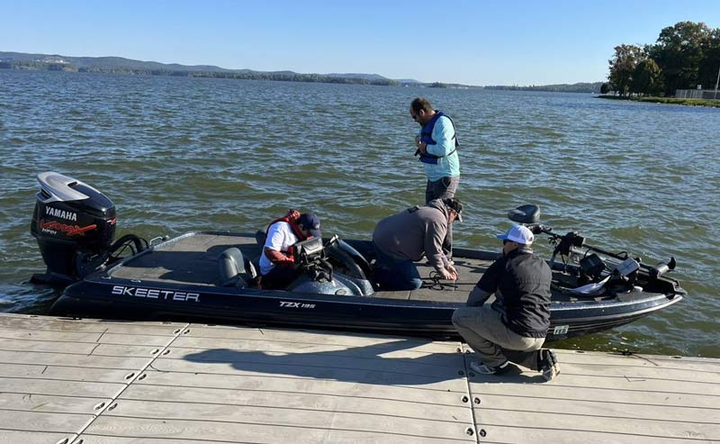 Participant Brayden Daniel boards a fishing boat.  