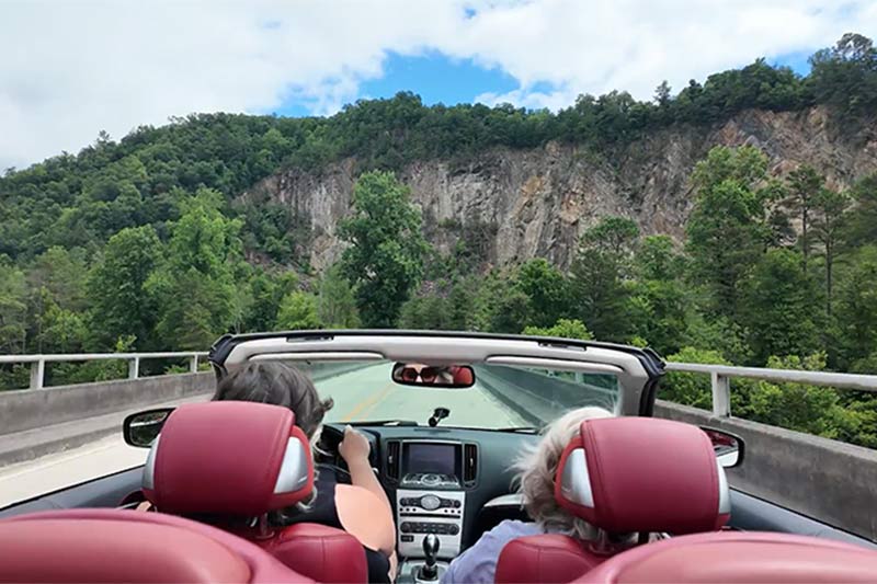 Pat Ezzell and Ashley Walker drive Tail or the Dragon near Fontana Dam