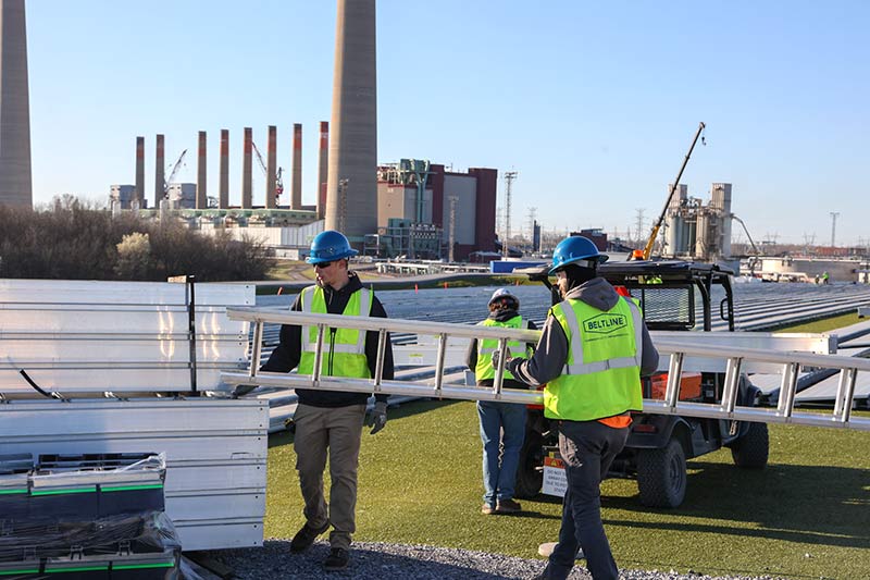 Project Phoenix crews handling materials for solar field