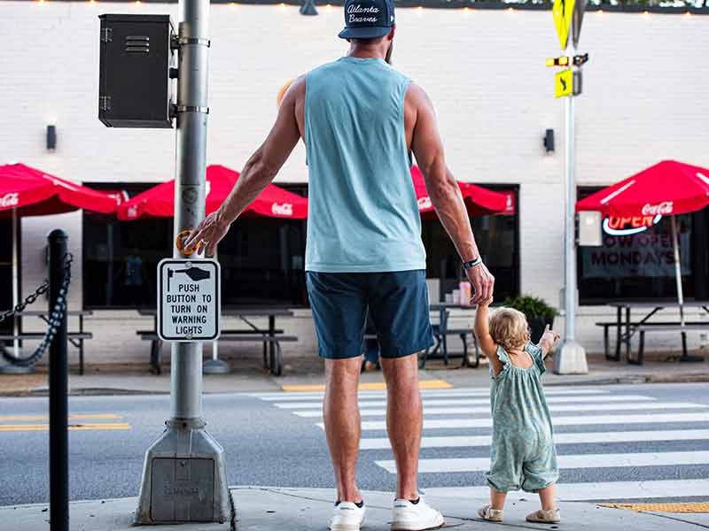 Dad and child at crosswalk