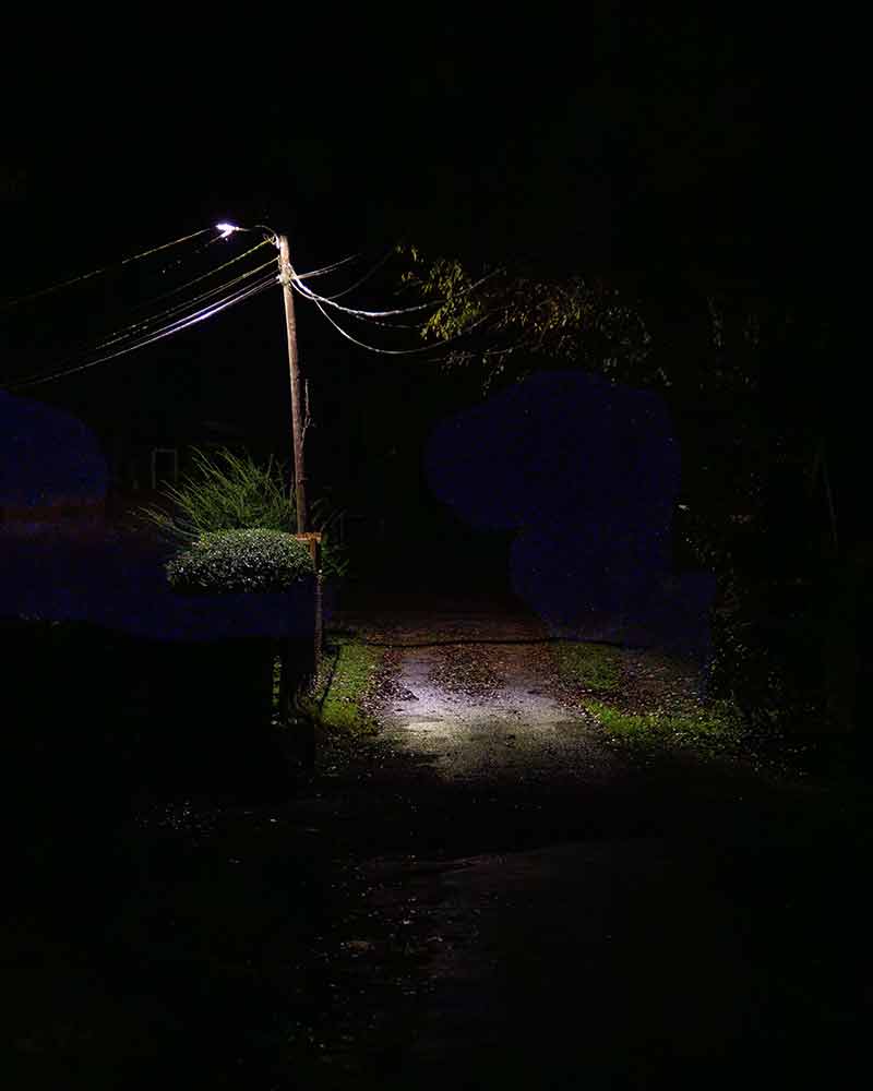 Street light on dark road.