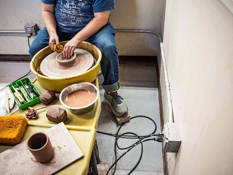 Potter at wheel plugged into outlet