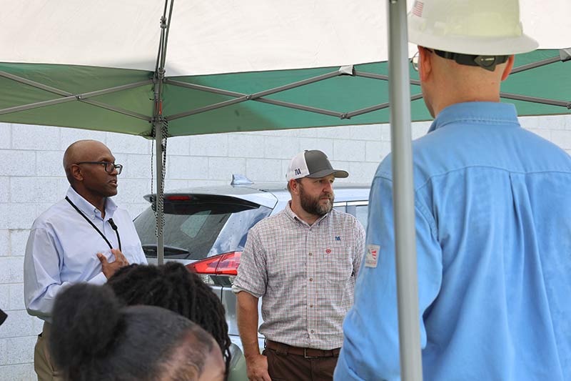 Demonstrating the drone technology, from left, is Quinton Clark, of Memphis Light, Gas and Water, and TVA drone pilot Robert Patrick.
