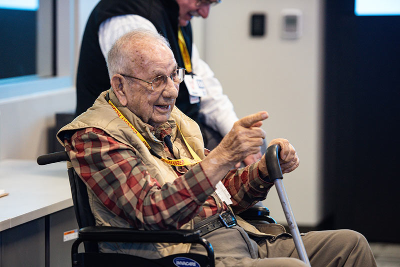 TVA retiree Hugh Gardner smiles and points to employee at SOC