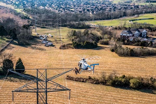 lineman working from helicopter