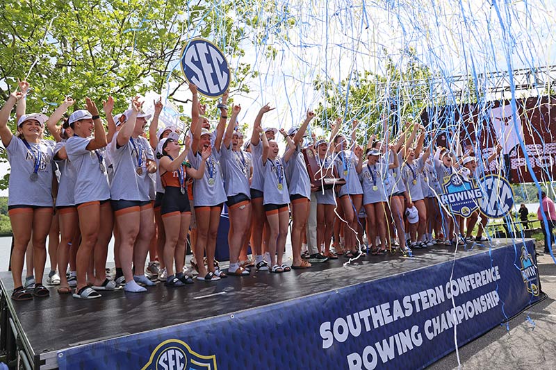Rowers celebrate after the SEC rowing event at Melton Hill Reservoir