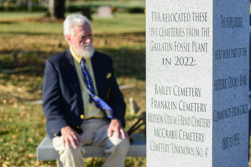 Historic Odom’s Bend Cemetery Reinterment Committee member and Sumner County historian Kenneth Thomson Jr. sits near a commemorative obelisk at the Garden of Eternal Freedom. 