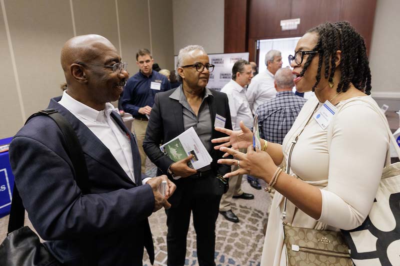 A man and woman enjoy a conversation at the Supplier Diversity Summit