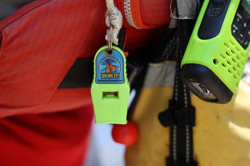 Safety whistle ranging from trainee life jacket