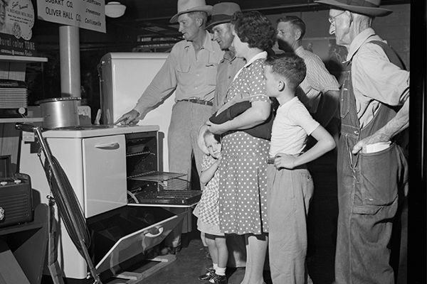 people looking at electric appliances