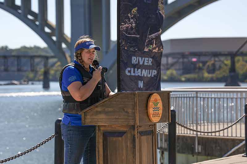Kathleen Gibi, founder of Keep the Tennessee River Beautiful, speaks in front of the Tennessee River