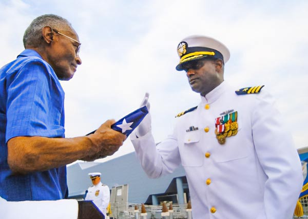 Tony White saluting his father on his retirement ceremony