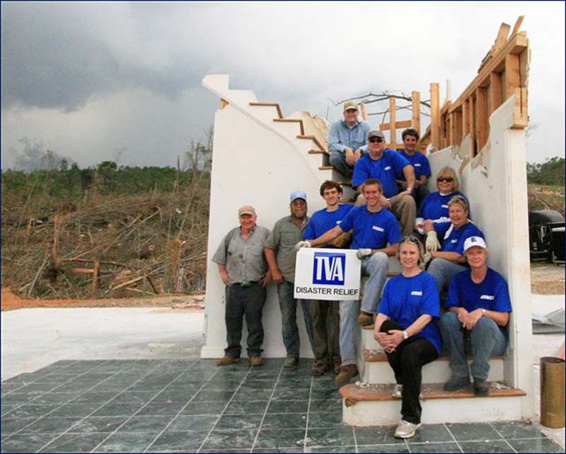 Tornado Volunteers sitting on the stairs