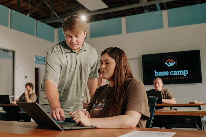Trey Shelton, technical director at Basecamp Coding Academy, assists a student.