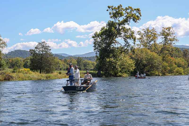 Three people in fishing boat.