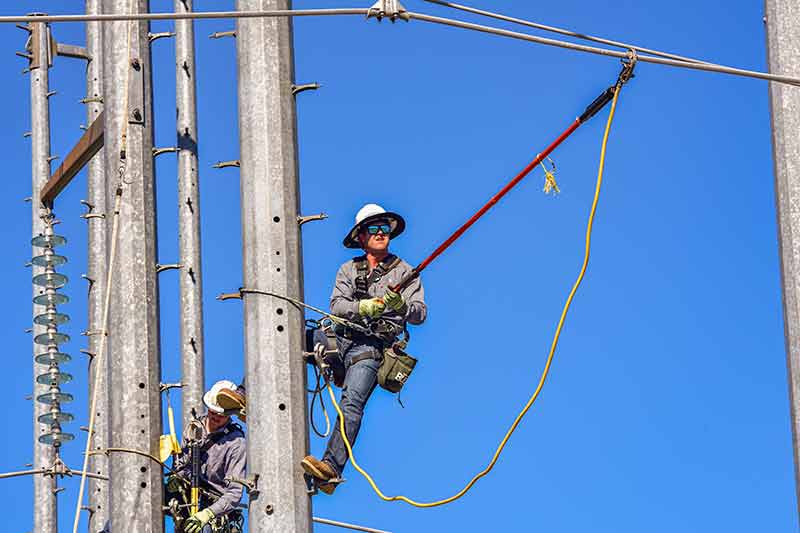 Apprentice lineworkers practice skills at climbing school in Alabama.
