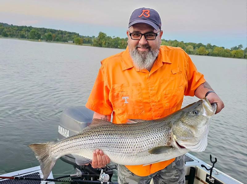 TVA Fun photo of fisherman holding up huge fish