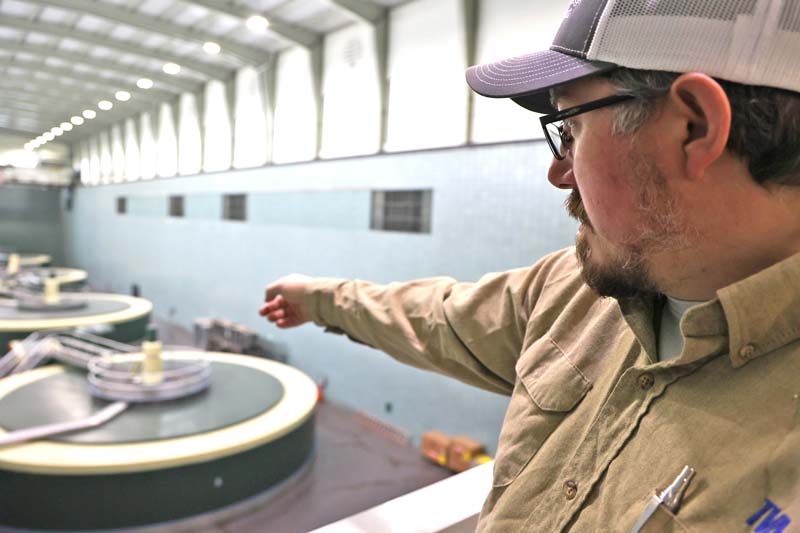 TVA hydro technician Brad Sands points out components critical for safe and reliable dam operation