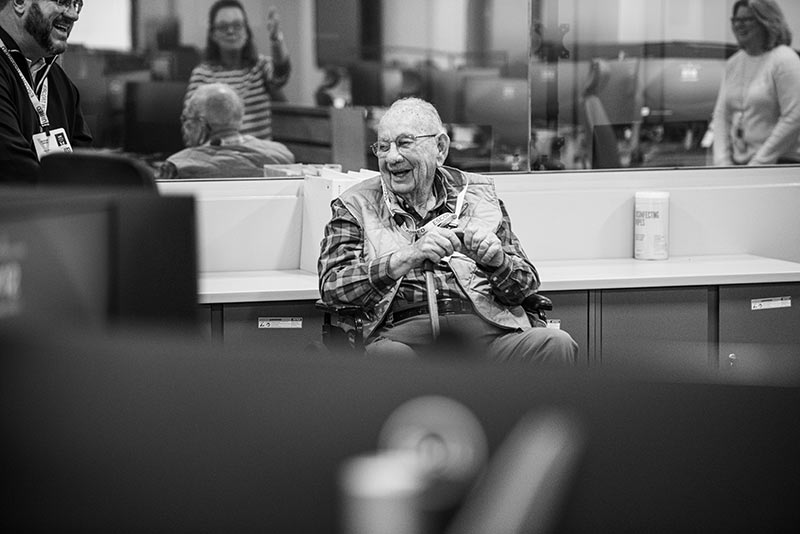 TVA retiree Hugh Gardner visits with employees in SOC