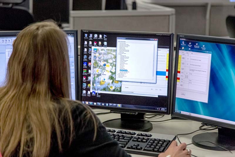 A TVA River Management team member monitors data inside the River Forecast Center