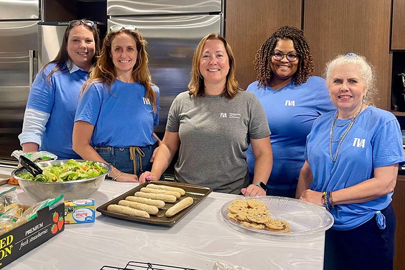 Week of Service volunteers serve food