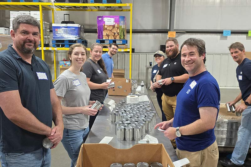 Week of Service volunteers package food