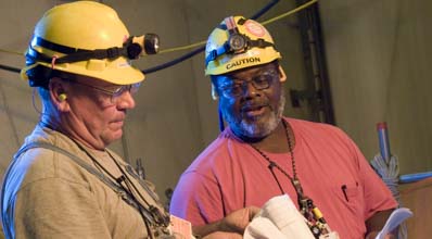 two men hard hats two men hard hats