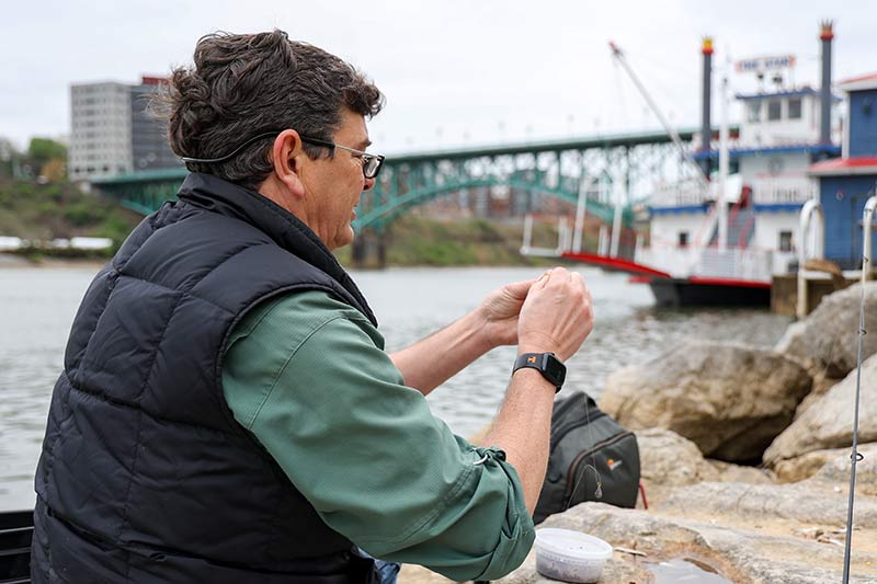 Bo Baxter ties a fishing line