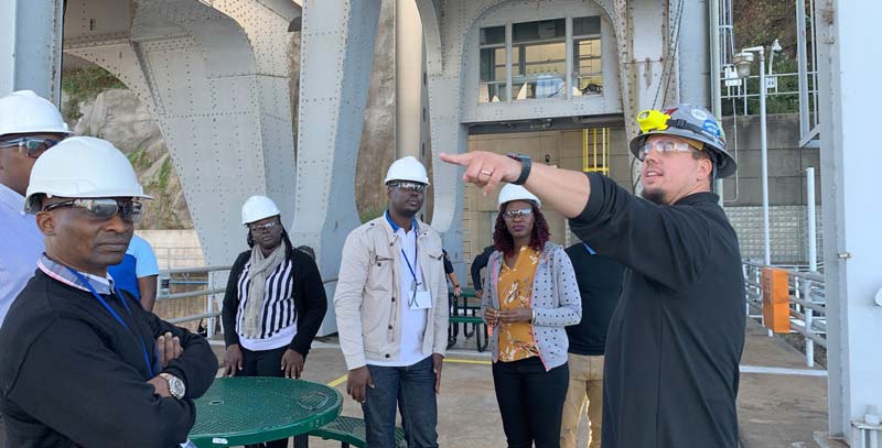 Plant Manager gives Uganda guests a tour of plant