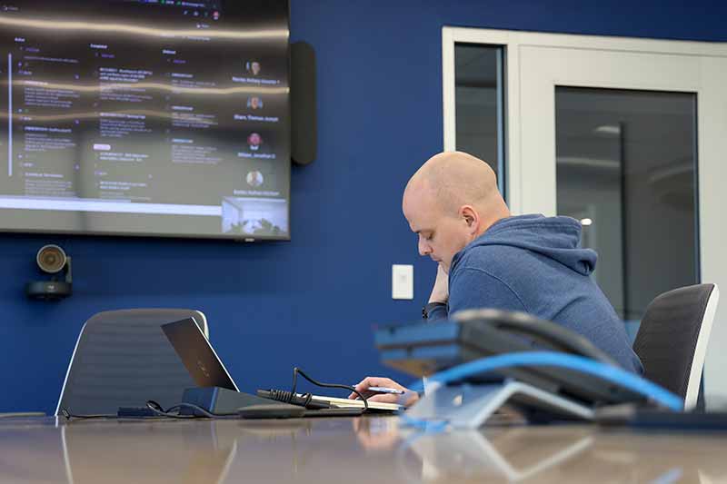 Miles Yaw working on laptop