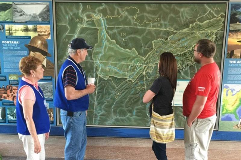 TVA volunteers Ralph and Linda Rose chat with guests at Fontana Dam.