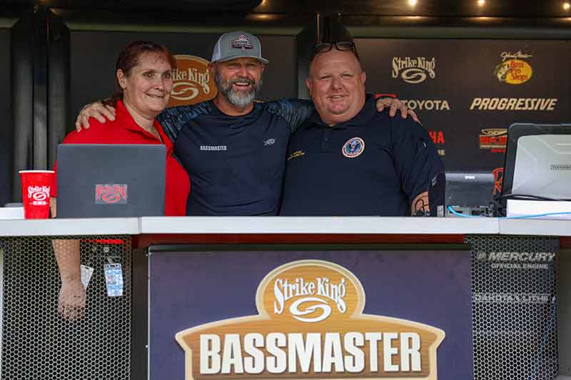 Carter County Emergency Management director Catherine Umrichin and deputy director Lucas Gragg flank Bassmaster's Glenn Cale at the Bassmaster College Classic.