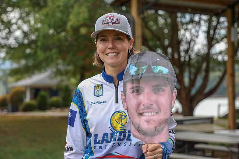 Mom holds cardboard cutout of Andrew Blanton at event