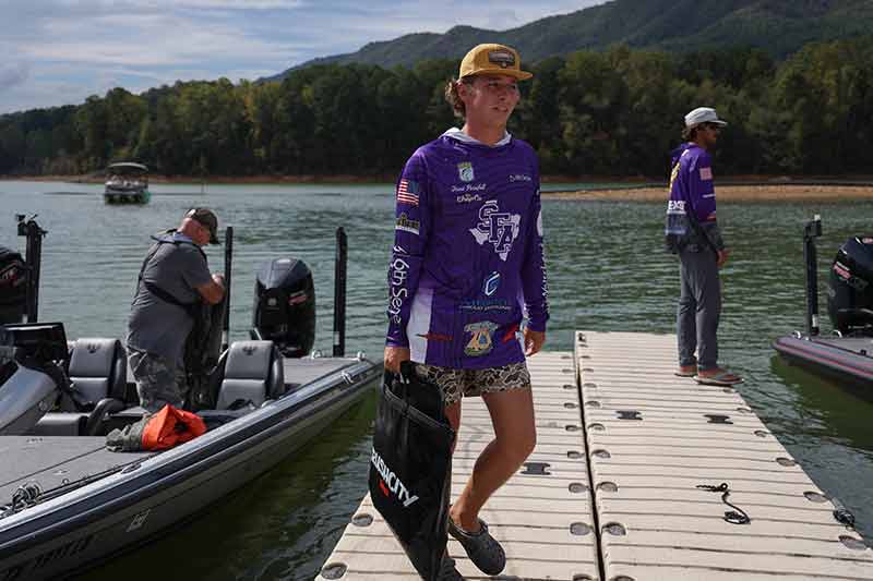Grant Pursifull, of Stephen F. Austin State University, returns after a day of fishing on Watauga Reservoir.