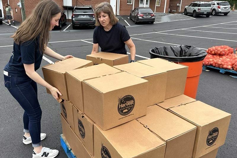 Week of Service 92nd anniversary volunteers loading boxes