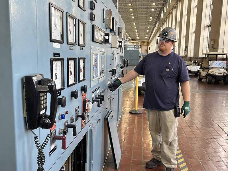 Hydro Technician Derrick Holt studies gauges