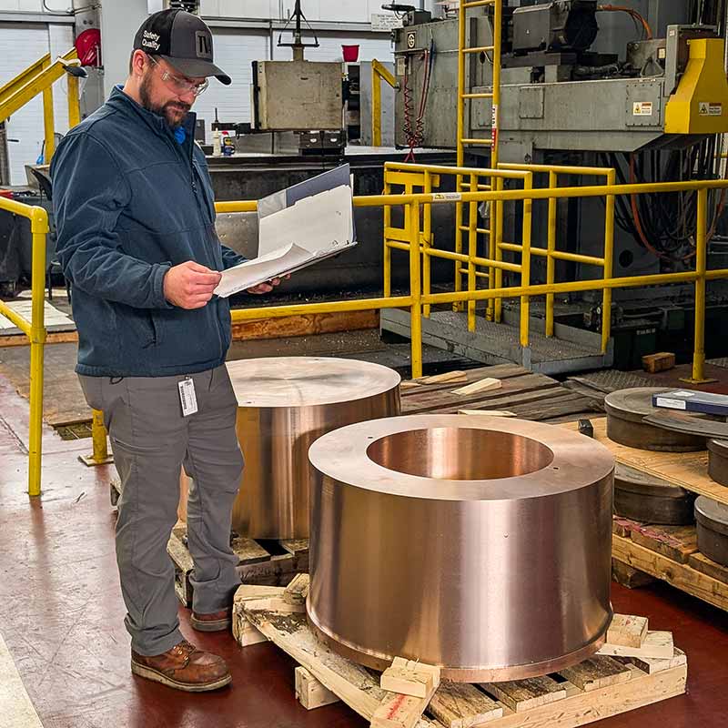 Joseph Hardwick with machined parts