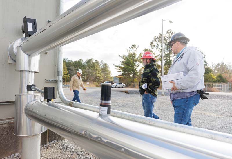 Workers inspect equipment at Gallatin Combustion Turbine Plant