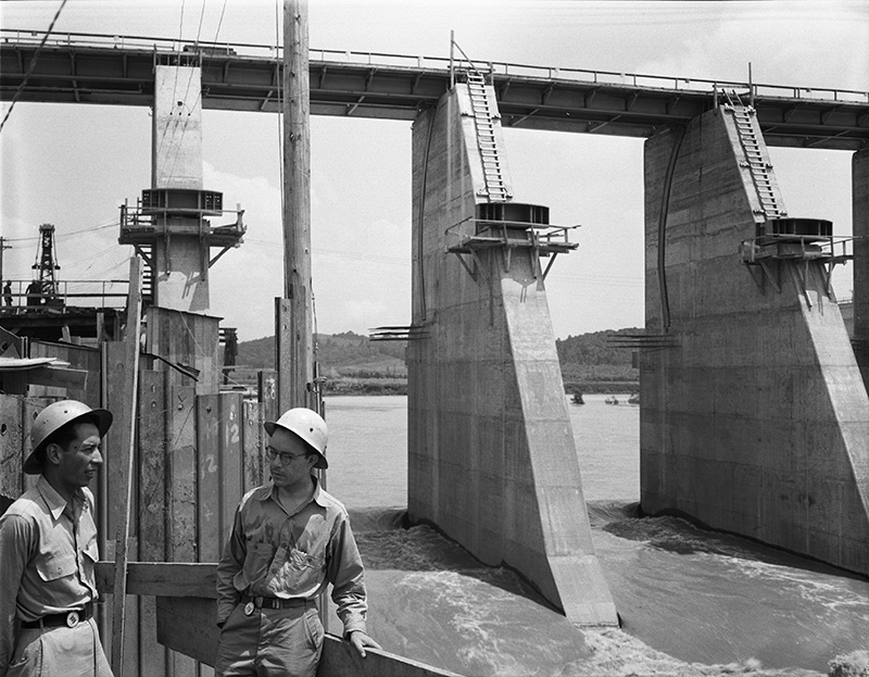 Two visitors from Mexico viewing dam in 1942