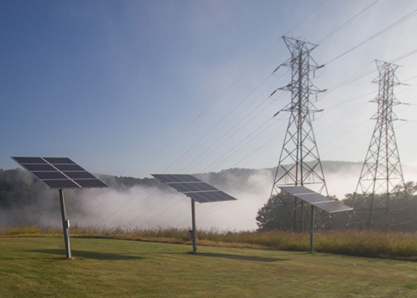 Solar panels near transmission towers