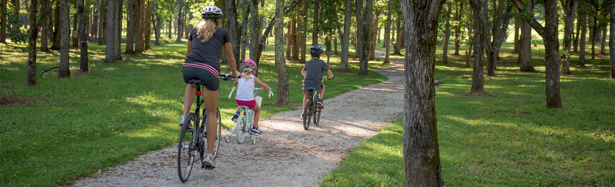 Mother and kids biking on a trail at Norris Dam