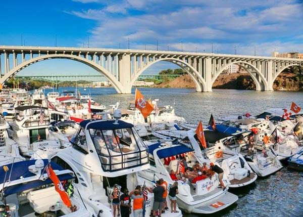  A group of boats docked under a bridge