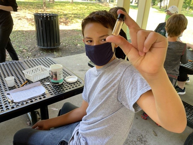 Boy testing water quality