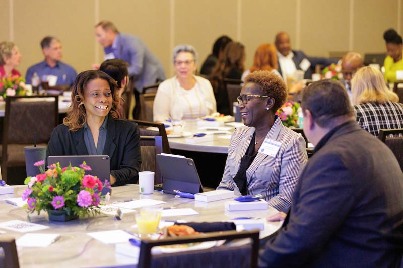 Attendees seated at a table during the 2023 Supplier Diversity Summit