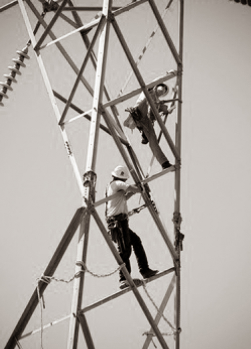 Workers working in a transmission tower