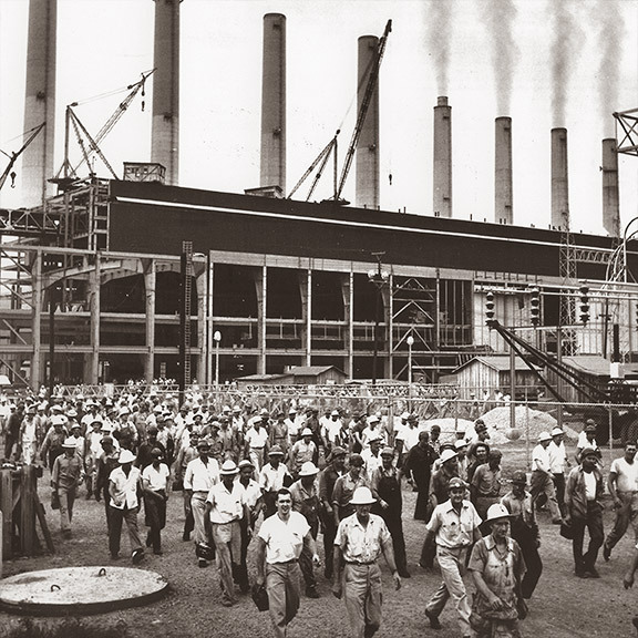 workers leaving the plant after work