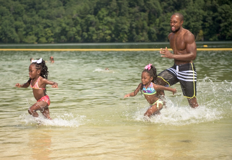 Kids running in a lake